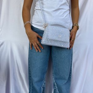 A cross bead bag and a medium-sized handbag