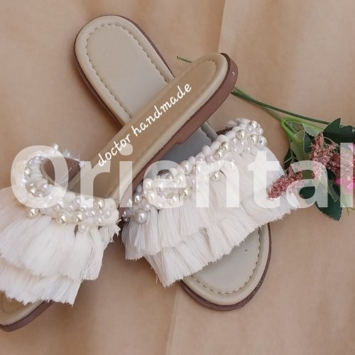 Macrame slipper decorated with Loly