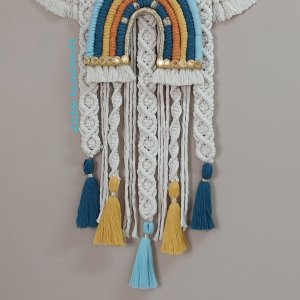 Macrame hanging  in the shape of a cloud with the child’s name