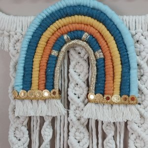 Macrame hanging  in the shape of a cloud with the child’s name