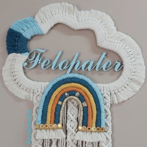 Macrame hanging  in the shape of a cloud with the child’s name