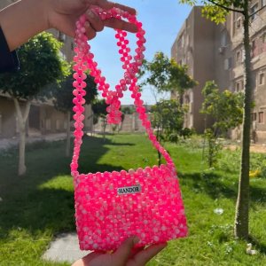 Crossbody bag with pink and white beads