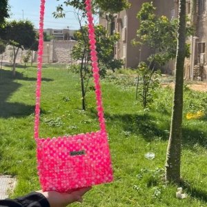 Crossbody bag with pink and white beads