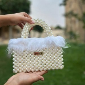 Loly handbag decorated with off white feathers