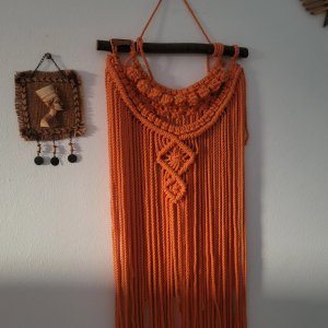 Orange macrame hanger for decoration