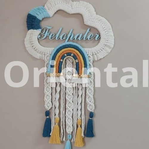 Macrame hanging  in the shape of a cloud with the child’s name