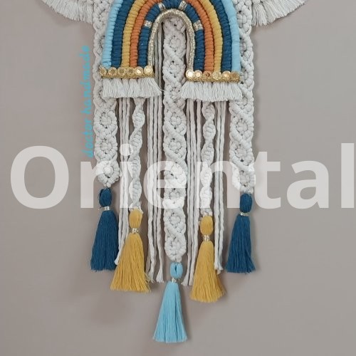 Macrame hanging  in the shape of a cloud with the child’s name