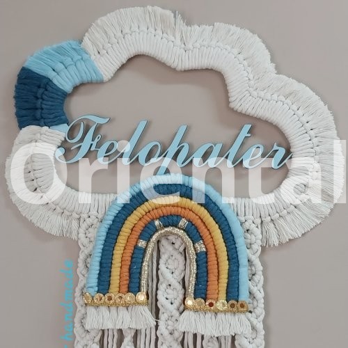 Macrame hanging  in the shape of a cloud with the child’s name