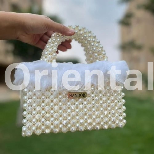 Loly handbag decorated with off white feathers