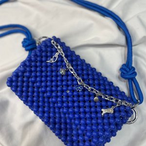 blue shoulder beaded bag with a Rope handle