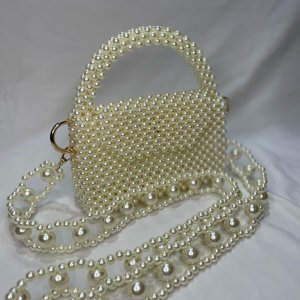 pearls beaded bag with a unique handle