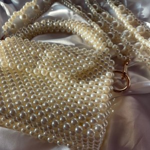 pearls beaded bag with a unique handle