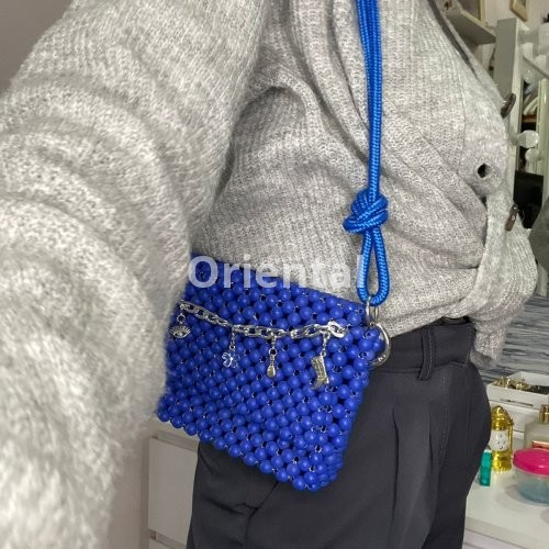 blue shoulder beaded bag with a Rope handle