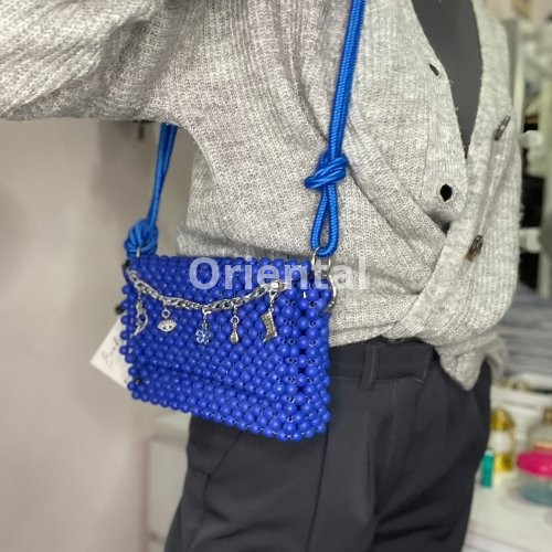 blue shoulder beaded bag with a Rope handle