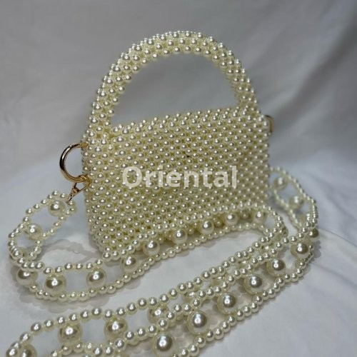 pearls beaded bag with a unique handle