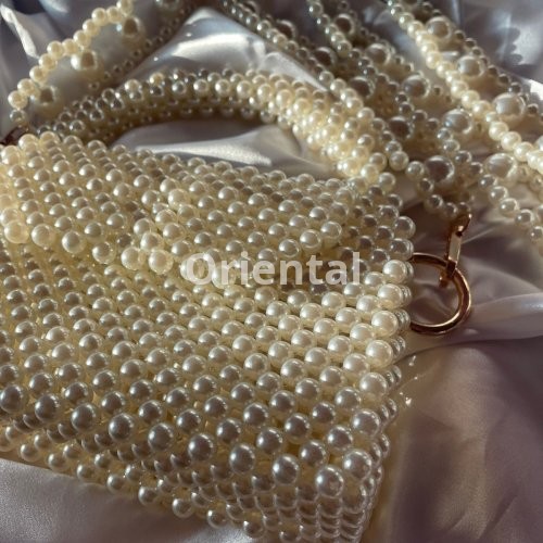 pearls beaded bag with a unique handle